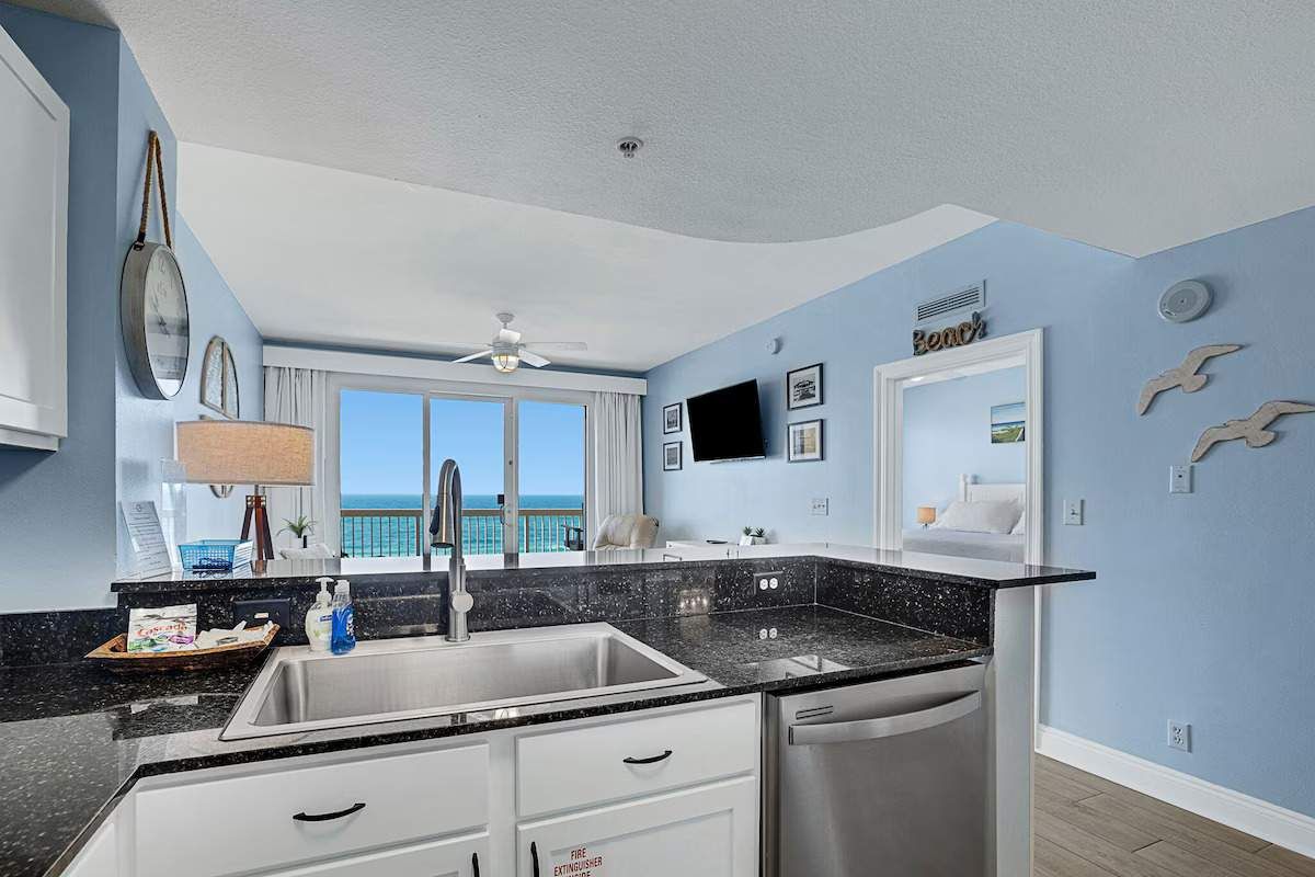 Kitchen with dishwasher, microwave, stove, refrigerator with ice maker