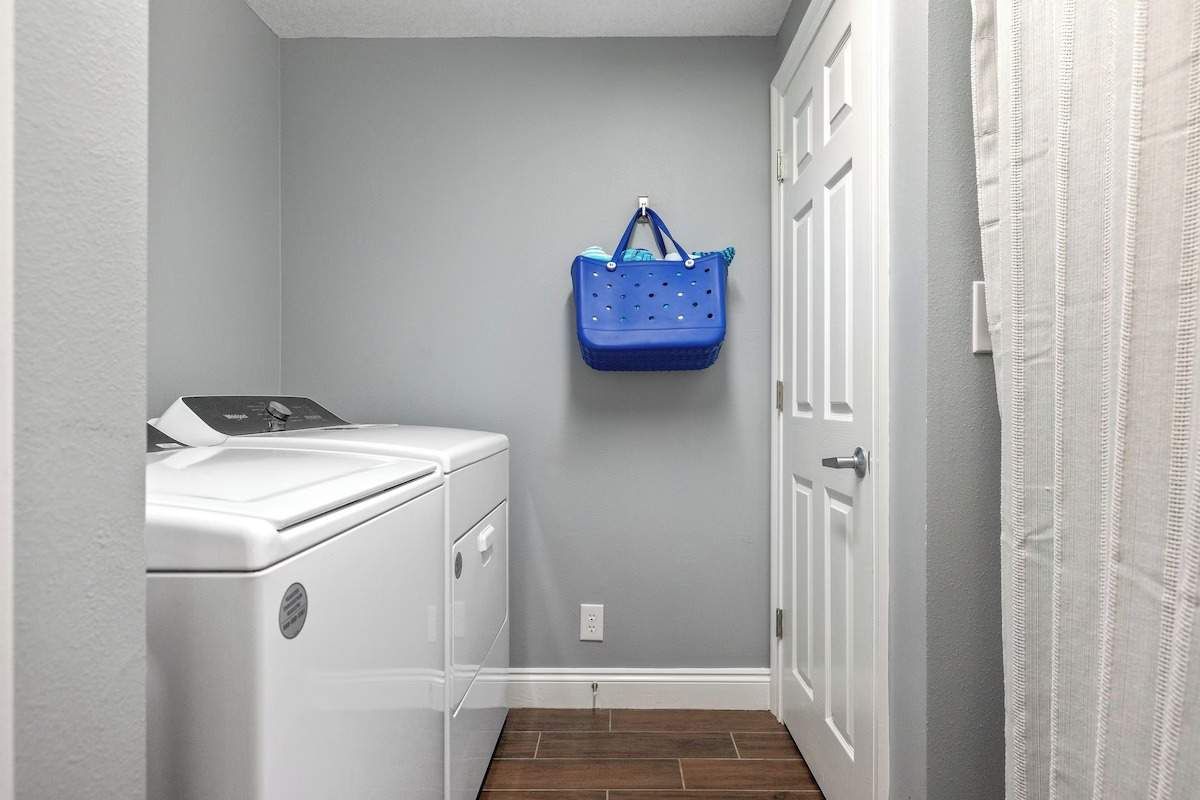 Laundry Room with washer and dryer.  Beach bag and towels as well.  