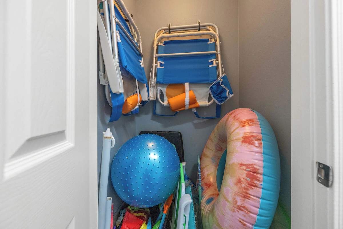 Additional chairs and beach toys located in the laundry room closet.
