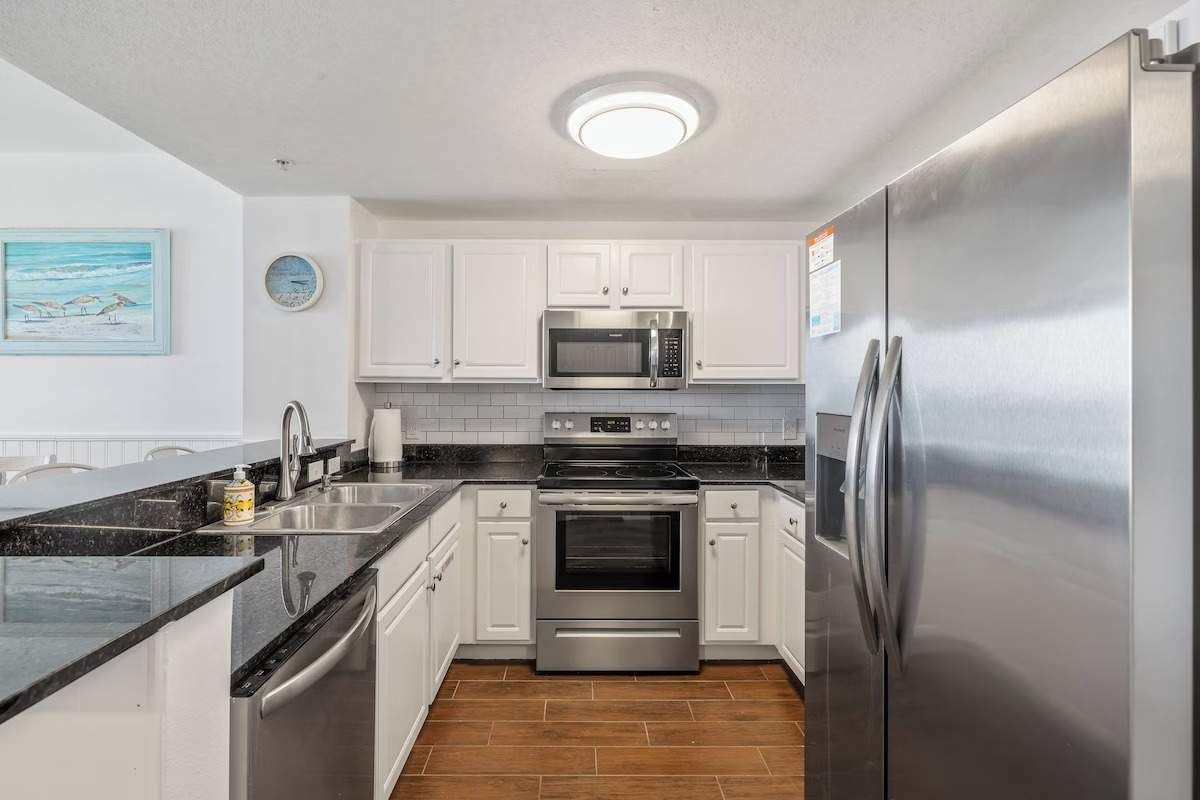 Kitchen - fully stocked with dishes, pots, and pans.  Cook all your meals here!